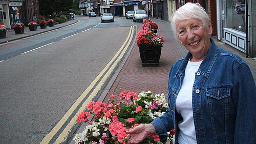 Celia admiring the planters in Stockton Heath