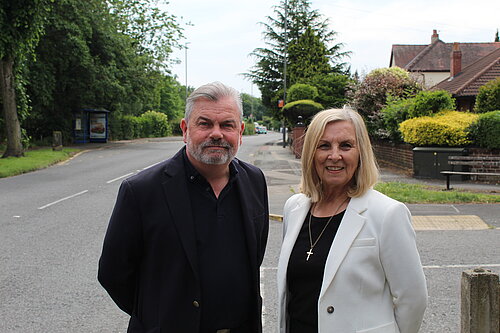 Mark and Helen standing in a street in Grappenhall